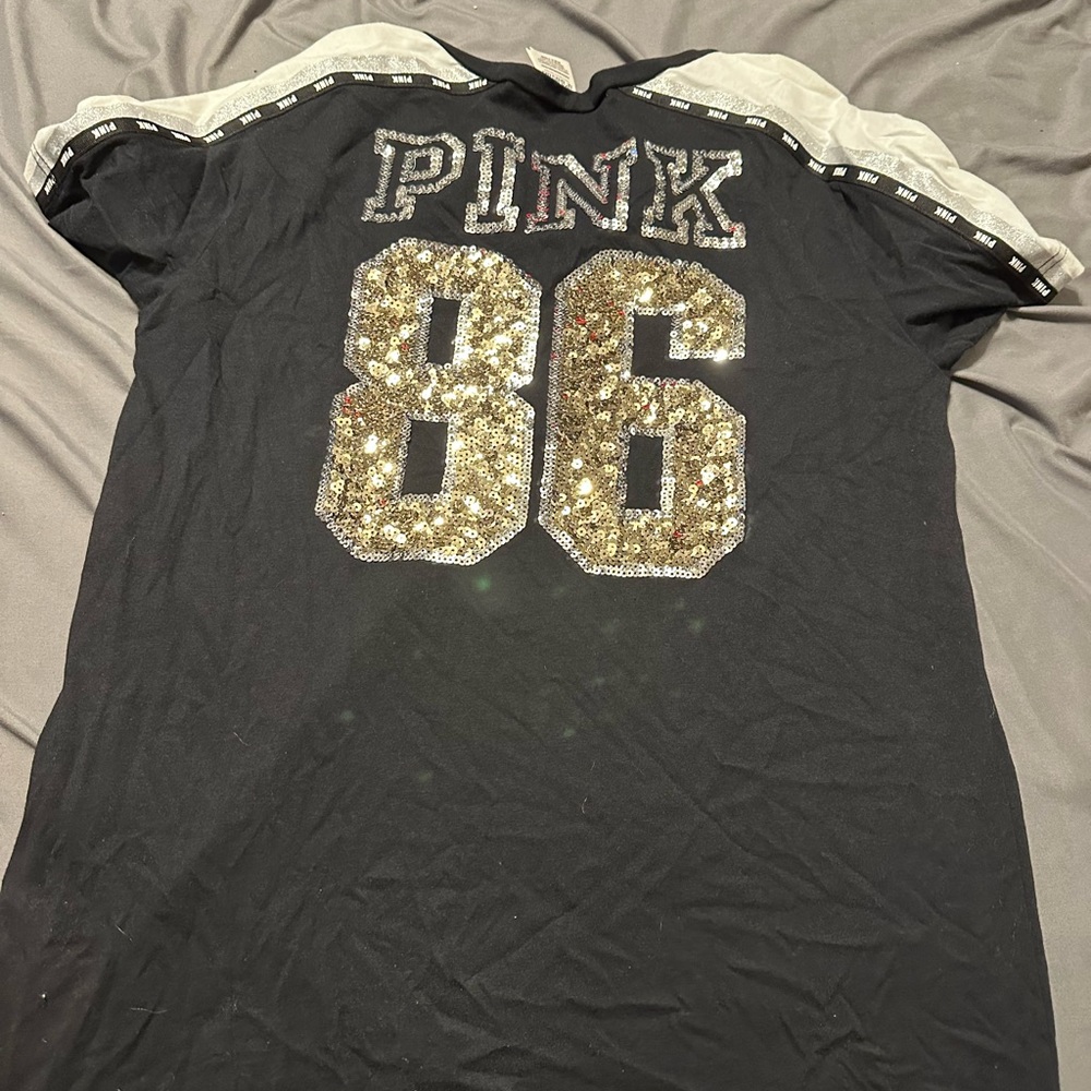 pink size medium fancy tee shirt slightly worn